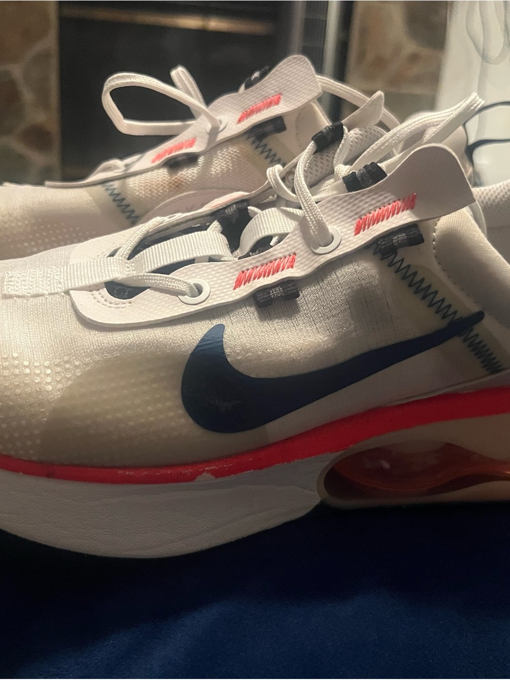 Nike Kids White Sneakers with Navy Swoosh and Red Accents